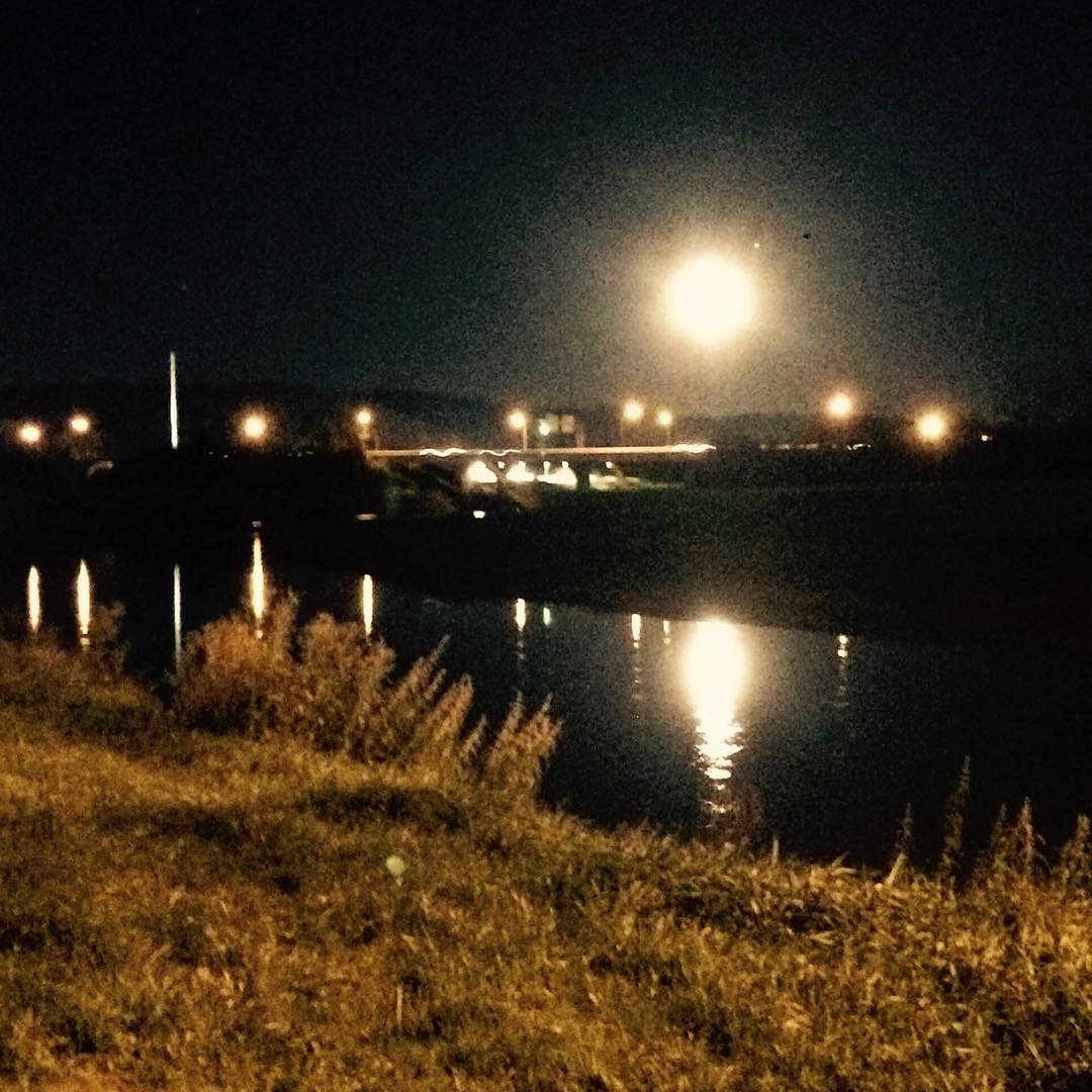 Bright moon reflecting off river