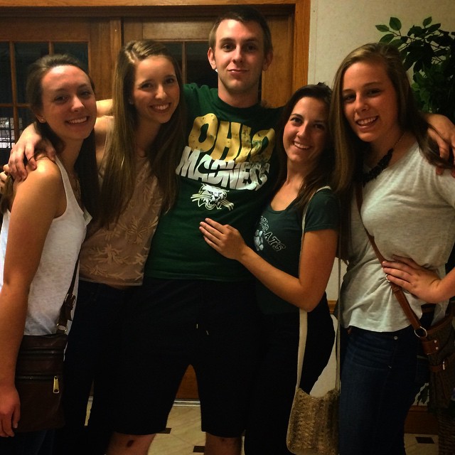 Jamison with arms around 4 girls